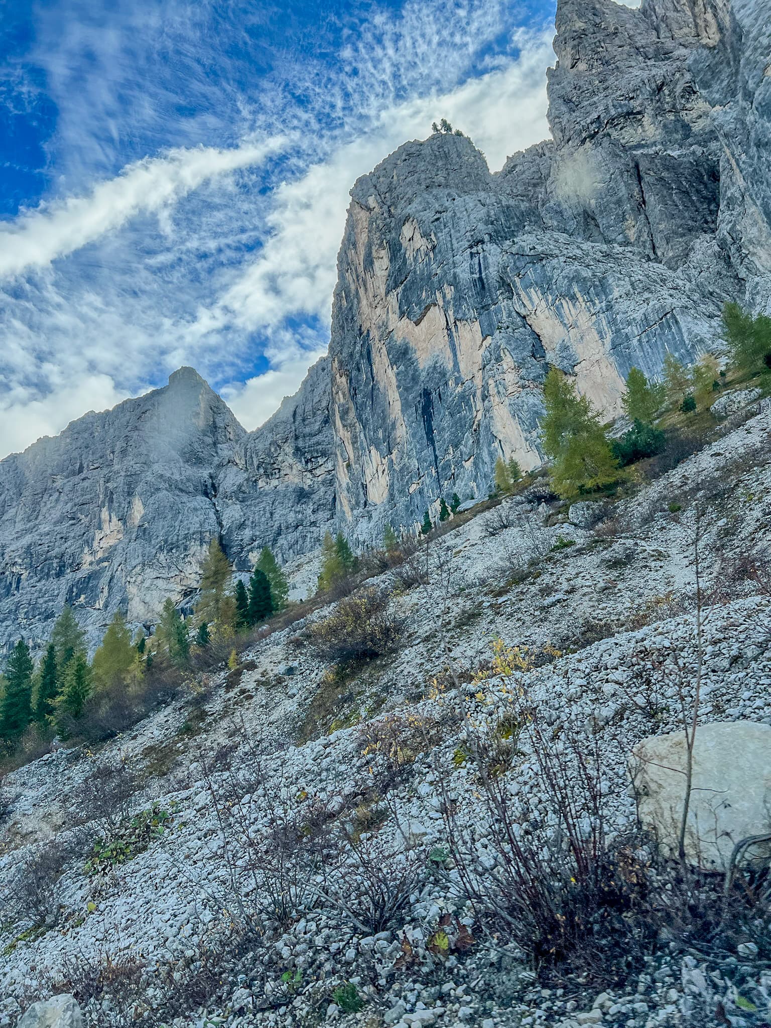 Jagged rocky peaks against a streaked sky