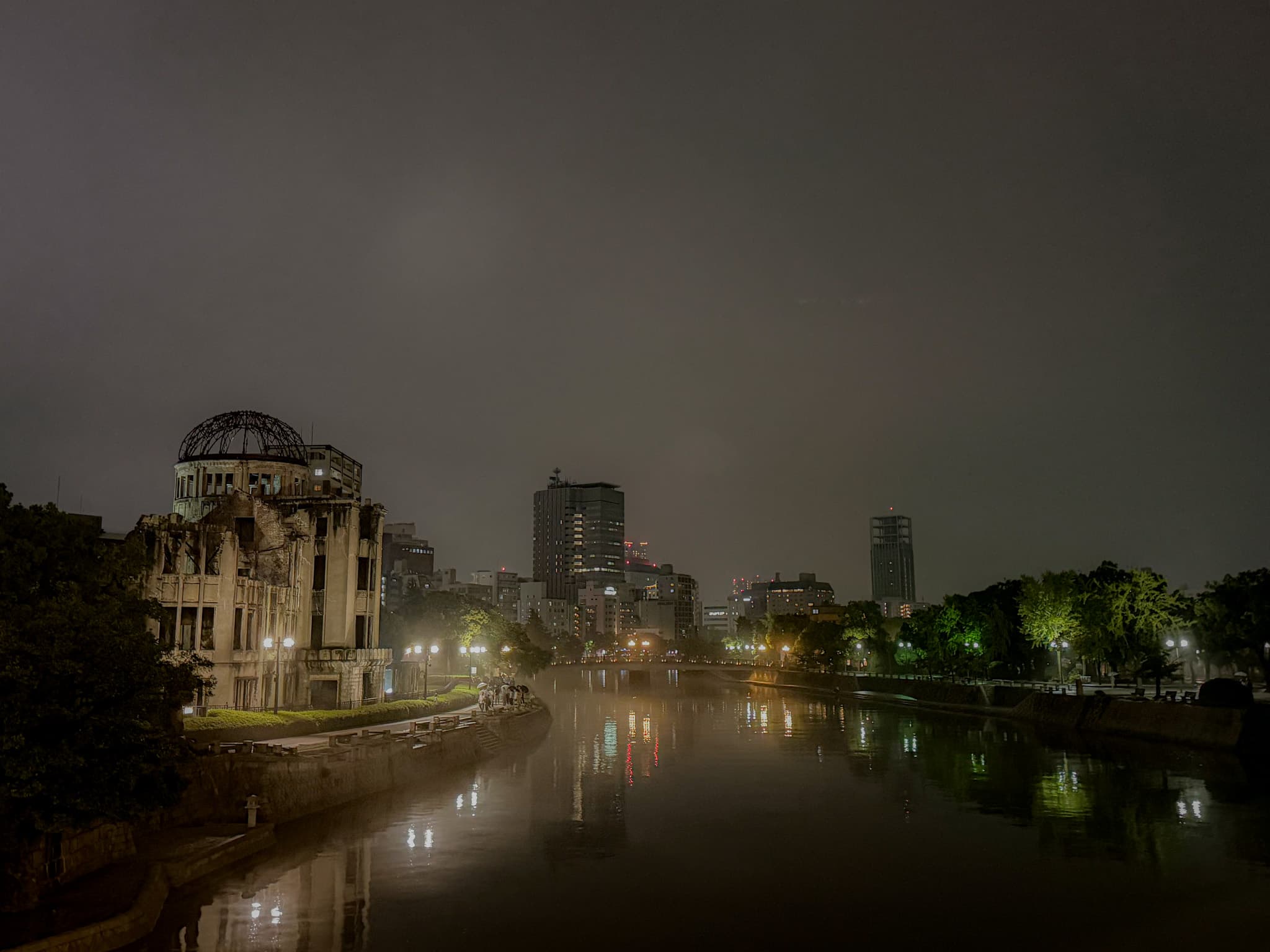 Atomic Bomb Dome and city lights across the river