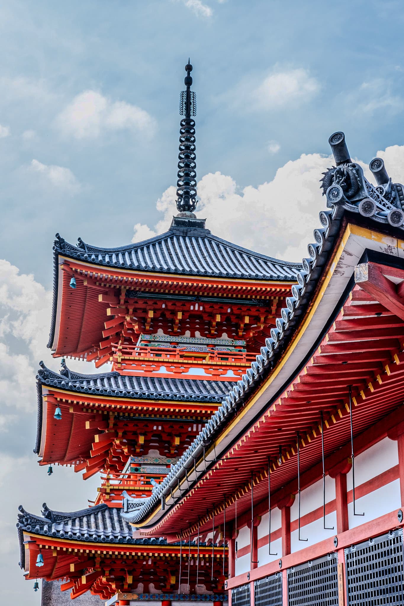 Red pagoda roofs against a blue sky