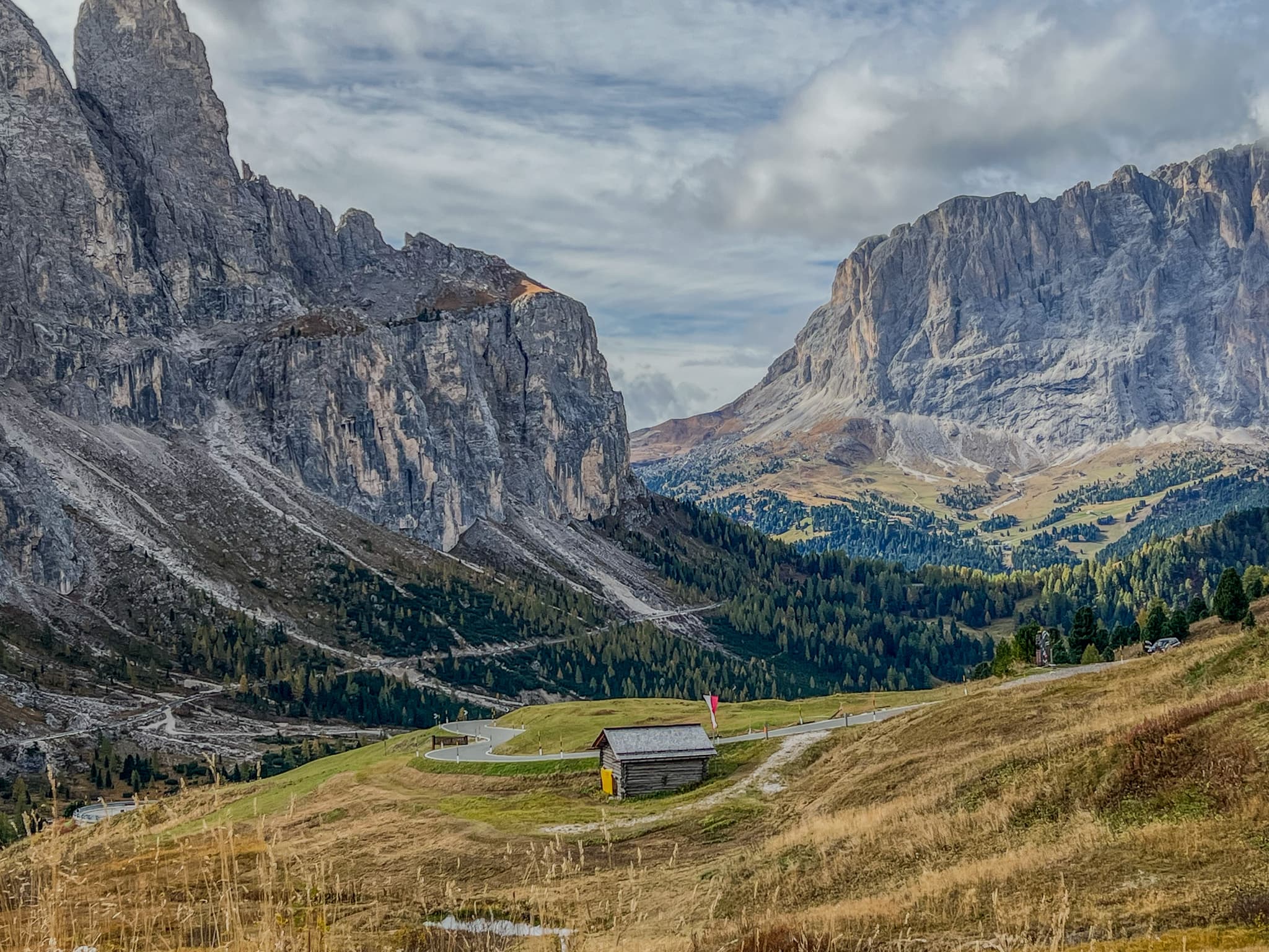 Mountain pass with a small hut in golden grass