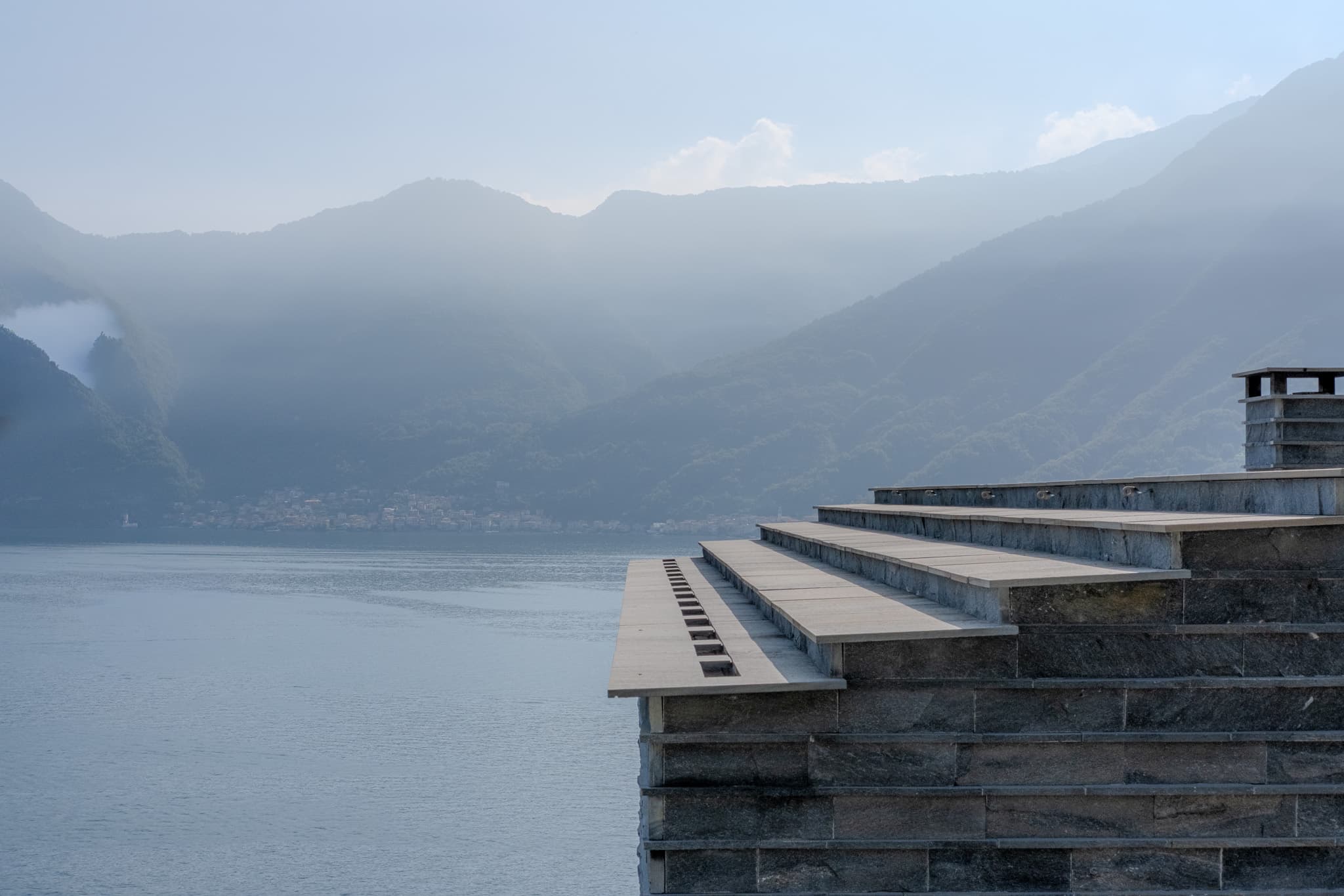 Slate rooftop above a hazy lake
